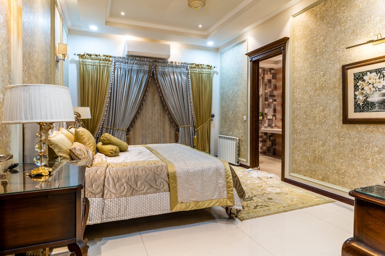 A sophisticated bedroom featuring elegant decor and luxurious furniture.